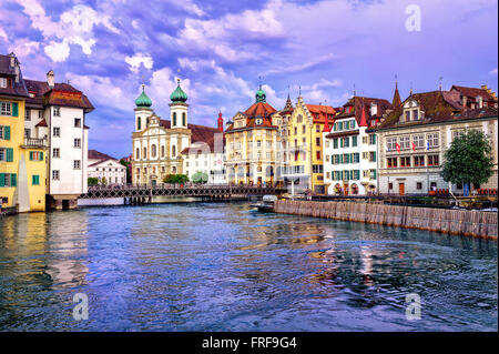 Lucerne, Switzerland, on sunset. View over Reuss river to Jesuit Church Stock Photo