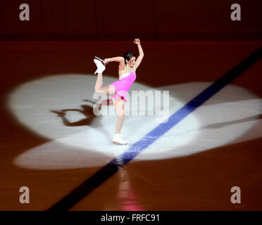 Female ice skater performing. Stock Photo