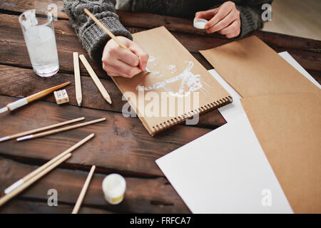 Drawing with white gouache Stock Photo