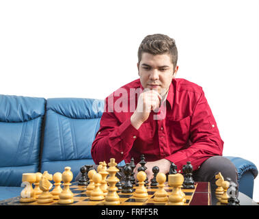 Portrait of a young man thinking during a chess match. Stock Photo