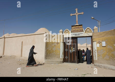 Christians outside St Tawdros (St Theodore's) Coptic Orthodox Christian Monastery, Luxor, Nile Valley, Egypt. The Copts are an ethno-religious group in North Africa and the Middle East, mainly in the area of modern Egypt, where they are the largest Christian denomination. Christianity was the religion of the vast majority of Egyptians from 400–800 A.D. and the majority after the Muslim conquest until the mid-10th century. Today, there are an extimated 9-15m Copts in Egypt. Stock Photo