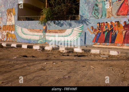 Modern hieroglyphic artwork painted on a wall of local wasteground in the village of Gezirat on the West Bank of Luxor, Nile Valley, Egypt. Stock Photo