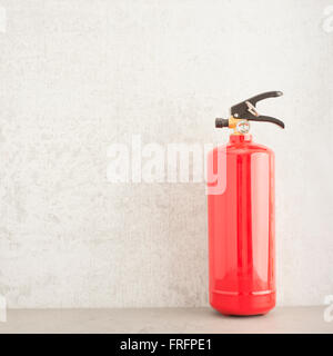 Fire extinguisher still life. Concept of fire prevention, safety equipment and home security. Stock Photo