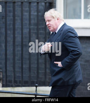 London, UK. 22nd March, 2016. Armed Police patrol down Whitehall ...