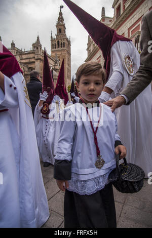 March 22, 2016 - Seville, Spain - An altar boy of the Brotherhood called ''El Cerro'' returns to its chapel after its parade to Cathedral on Holy Tuesday, day called Martes Santo in Spanish (Credit Image: © Daniel Gonzalez Acuna via ZUMA Wire) Stock Photo