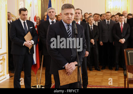 Bratislava, Slovakia. 22nd Mar, 2016. Smer-SD leader and Prime Minister Robert Fico (front) gives a speech after signing an agreement of a common coalition in the creation of the new Government of the Slovak Republic, in the representative rooms of Bratislava Castle, in Bratislava, capital of Slovakia, on March 22, 2016. Ruling political party Smer-SD will form new government with three coalition partners, Slovak National Party (SNS), Most-Hid and Siet, announced their leaders at a press conference on Tuesday. © Andrej Klizan/Xinhua/Alamy Live News Stock Photo
