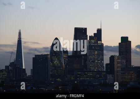 View of the City of London, including the Shard and Gherkin, seen from Hackney, East London. Sun set. Stock Photo