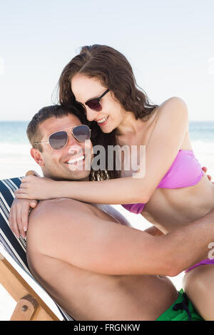 Girlfriend sitting on boyfriend lap Stock Photo