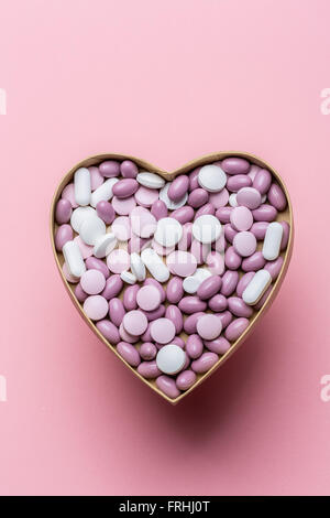 Generic pills and capsules in heart shape. Stock Photo
