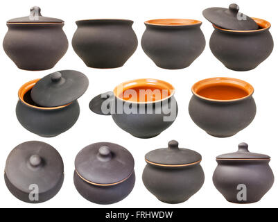 set of ceramic pots from black unglazed clay isolated on white background