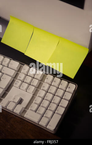Post it sticking on a computer Stock Photo