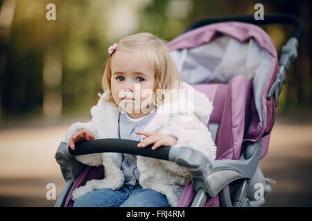 young family walking in the park Stock Photo