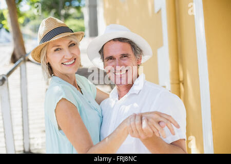 Portrait of happy couple holding hands Stock Photo