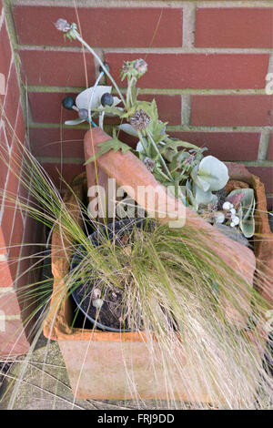 Broken flower pot container Stock Photo