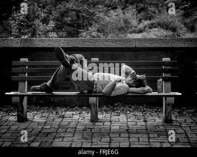 Man sleeping on bench outside Central Park, New York City, USA Stock ...