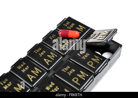 Days of the week pillbox on white background Stock Photo