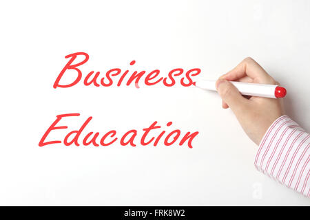 Business woman writing business education word on whiteboard Stock Photo
