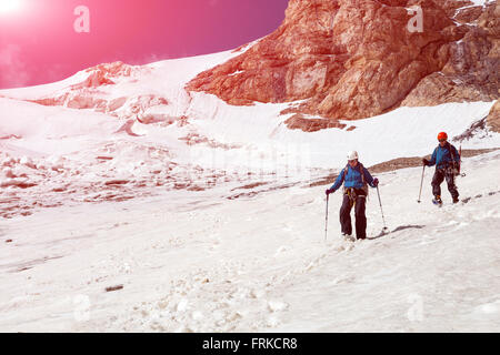 Climbing Partners Walking Down on Glacier Stock Photo