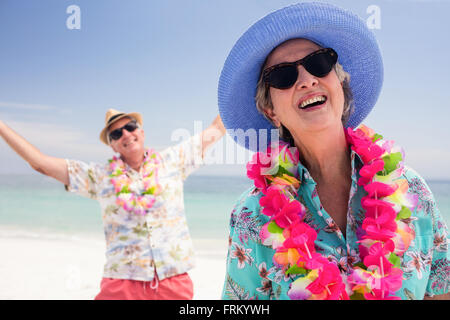 Happy senior couple having fun together on the beach Stock Photo