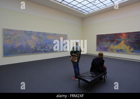 visitors looking at Claude Monet's Les Nympheas water lilies in the Kunsthaus Zurich, Switzerland Stock Photo