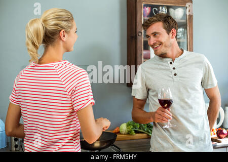 Happy young couple in kitchen Stock Photo
