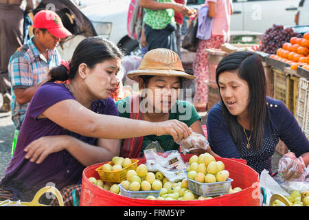 Fruit vendors at the Thiri Mingala Market in Yangon, Myanmar Stock Photo