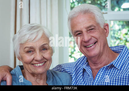 Close-up happy senior couple with arm around Stock Photo