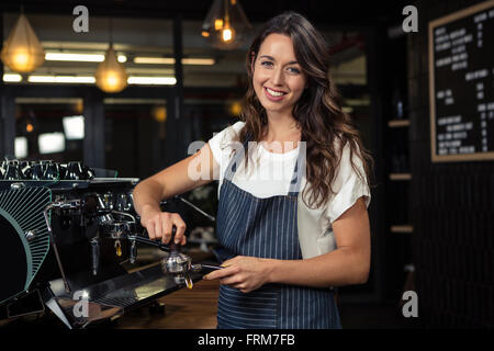 Barista preparing coffee with machine Stock Photo