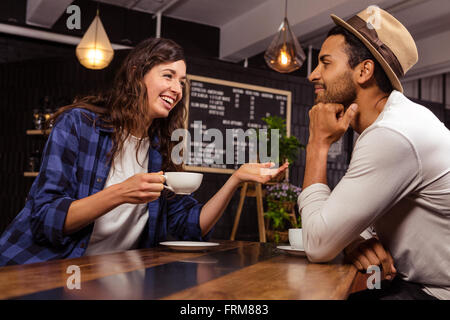 Couple talking and drinking coffee Stock Photo