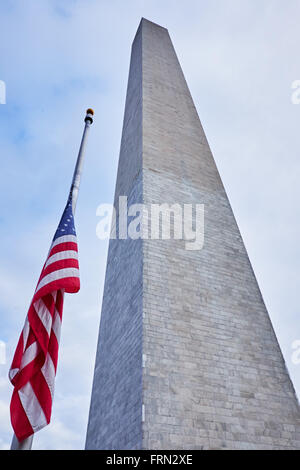 WASHINGTON, D.C. - OCTOBER 12, 2014: Looking up the Washington Monument with one flag in absolutely no wind Stock Photo