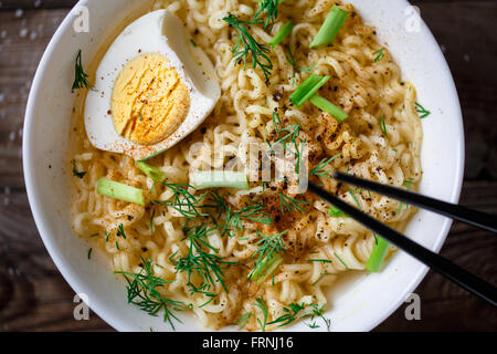 Asian noodles with fresh green onion and boiled egg Stock Photo