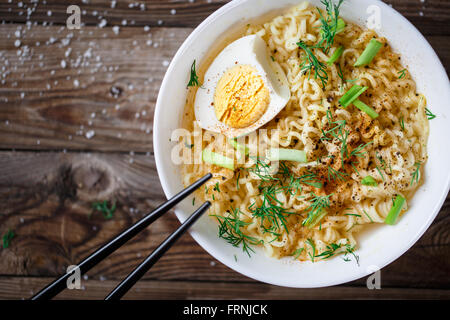 Asian noodles with fresh green onion and boiled egg Stock Photo