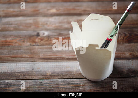 Blank Chinese food container on old wood table Stock Photo