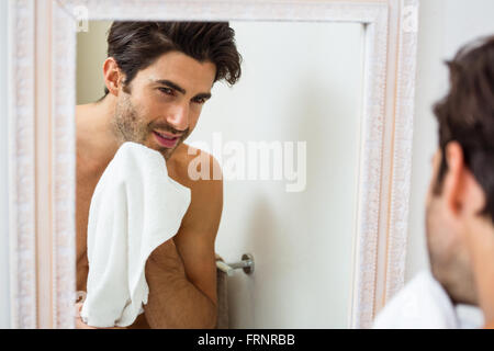 Man wiping his face with napkin Stock Photo