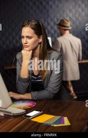 Creative businesswoman using computer Stock Photo