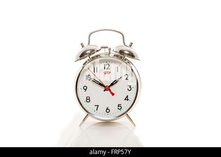 Mechanical alarm clock on a white background Stock Photo