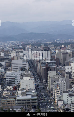 View from Kyoto Tower down Karasuma Street and the North of the City with traffic passing by on the streets below Stock Photo