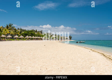 People relax on the Beach at Le Morne Brabant, one of the finest beaches in Mauritius Stock Photo