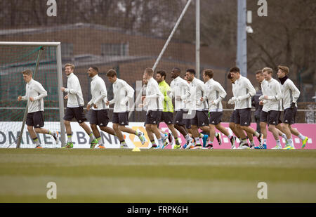 Berlin, Germany. 23rd Mar, 2016. Germany's players warm up during a training session of the German national soccer team at the amateur stadium of Hertha BSC in Berlin, Germany, 23 March 2016. The German national soccer team is preparing for its upcoming international friendly match against England to be held in Berlin on 26 March. Photo: ANNEGRET HILSE/dpa/Alamy Live News Stock Photo