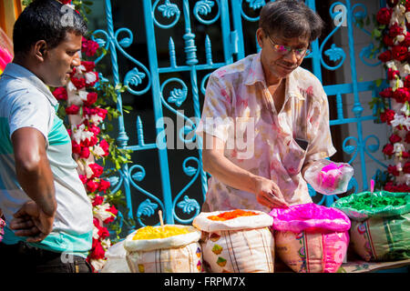 Dhaka, Bangladesh. 23rd March, 2016. A vendor selling pink (called Sidur color) buying on the occasion of Hindu Festival Holi, at Shankhari Bazar in Dhaka, Bangladesh on Wednesday, March 23, 2016. Credit:  Jahangir Alam Onuchcha/Ģ����ý Live News Stock Photo