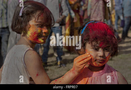 Kolkata, Indian state of West Bengal. 23rd Mar, 2016. Indian children celebrate the Holi festival at Shantiniketan, some 163 km from Kolkata, capital of eastern Indian state of West Bengal, March 23, 2016. Holi, also called the festival of spring, is a popular Hindu festival observed in India at the end of winter season on the last full moon day of the lunar month, which usually falls on the late February or March. Credit:  Tumpa Mondal/Xinhua/Alamy Live News Stock Photo