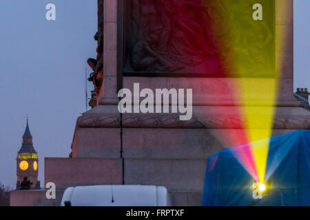 London, UK. 23rd March, 2016. The National Gallery in Trafalgar Square has two Belgian flags projected on its frontage in sympathy with attacks in Brussels.The projector was by Nelson's Column. Peter Marshall/Alamy Live News Stock Photo