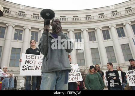 Denver, Colorado, USA. 21st Mar, 2016. In response to the crisis of homelessness in Denver, JERRY BURTON proposed the construction of tiny houses, the creation of spaces for the homeless to store their belongings, and the improvement of shelter facilities' capacity to house individuals struggling with addiction. On March 21, 2016, members of the collective Denver Homeless Out Loud and residents experiencing homelessness gathered on the steps of the City and County building to denounce the recent ''sweeping'' of homeless camps from city streets. Since March 8, city employees have removed th Stock Photo