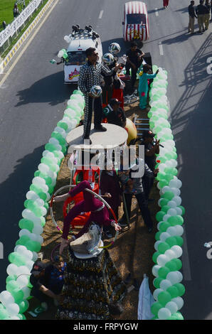 Lahore, Pakistan. 23rd Mar, 2016. Pakistani people celebrating Pakistan Day in Lahore. Pakistan celebrates its National Day to commemorate the adoption of the 1940 resolution (also known as the Pakistan or Lahore resolution) demanding a separate state for the Muslims of British-ruled India. Credit:  Rana Sajid Hussain/Pacific Press/Alamy Live News Stock Photo