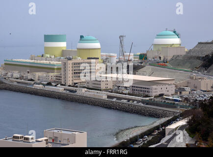 Ehime, Japan. 23rd Mar, 2016. Shikoku Electric Power Co.'s Ikata nuclear power plant reactor buildings one (L), two (C) and three (R) stand at Ikata town in Ehime prefecture, Japan's southern island of Shikoku on Wednesday, March 23, 2016. Japan's nuclear regulation authority approved to reactivate Ikata's reactor three on March 23 despite lingering safety concerns from the 2011 Fukushima nuclear accident. © Yoshio Tsunoda/AFLO/Alamy Live News Stock Photo