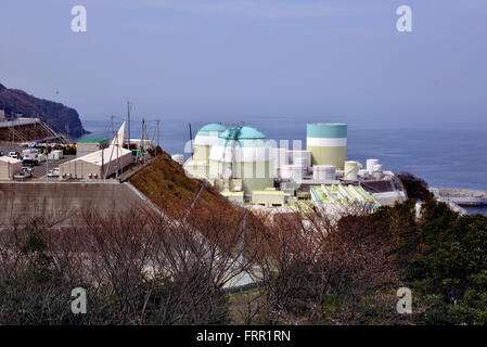 Ehime, Japan. 23rd Mar, 2016. Shikoku Electric Power Co.'s Ikata nuclear power plant reactor buildings one (R), two (L) and three (C) stand at Ikata town in Ehime prefecture, Japan's southern island of Shikoku on Wednesday, March 23, 2016. Japan's nuclear regulation authority approved to reactivate Ikata's reactor three on March 23 despite lingering safety concerns from the 2011 Fukushima nuclear accident. © Yoshio Tsunoda/AFLO/Alamy Live News Stock Photo