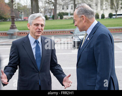 United States Senator Chuck Schumer (Democrat of New York), right, leads Judge Merrick Garland, chief justice for the US Court of Appeals for the District of Columbia Circuit, who is US President Barack Obama's selection to replace the late Associate Justice Antonin Scalia on the US Supreme Court, left, at a photo op at the US Capitol in Washington, DC on Tuesday, March 22, 2016. Credit: Ron Sachs/CNP (RESTRICTION: NO New York or New Jersey Newspapers or newspapers within a 75 mile radius of New York City) - NO WIRE SERVICE - Stock Photo