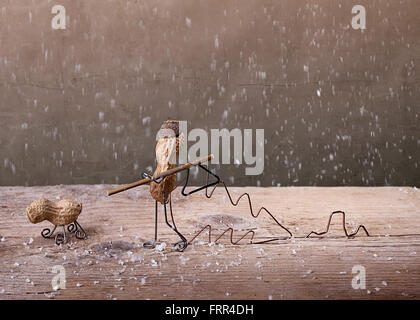 Simple Things - Miniature with Peanut People in the Forest to Fell a Christmas Tree Stock Photo