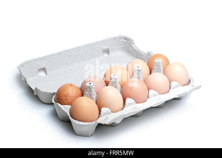 Twelve (dozen) brown eggs in a carton package Stock Photo