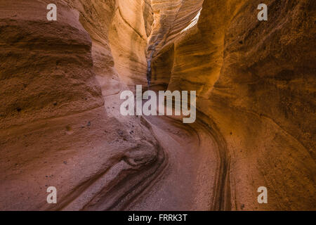 Hiking through the narrow slot canyon along the Slot Canyon Trail at Kasha-Katuwe Tent Rocks National Monument in New Mexico, US Stock Photo